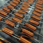 tray of Inductor windings on ferrite rod
